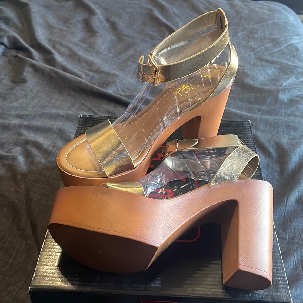 Currently selling gold/wooden heel wedges, size 9 for women!